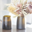 Revalued Glass Prestige Candle Vase from champagne bottles by Flickr by TBT, emitting a cozy Australian Wildflower scent, highlighting sustainable luxury and versatility in home decor