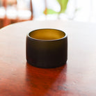 Close-up view of the intricate craftsmanship of the ReValued Glass Punt Dish, emphasizing the authentic, natural beauty of the glass and its ethical, upcycled heritage