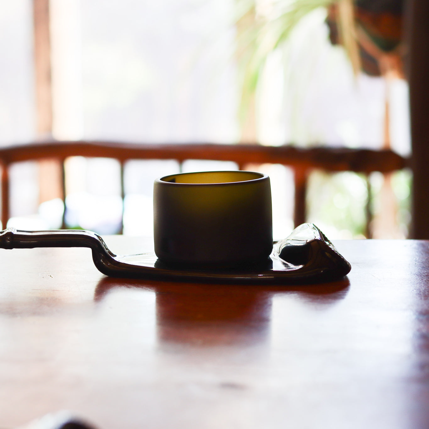 Handcrafted Prestige Collection Punt Dish by ReValued Glass, showcasing the entertainment options and historical silhouette of upcycled champagne bottles for a blend of luxury and sustainability.