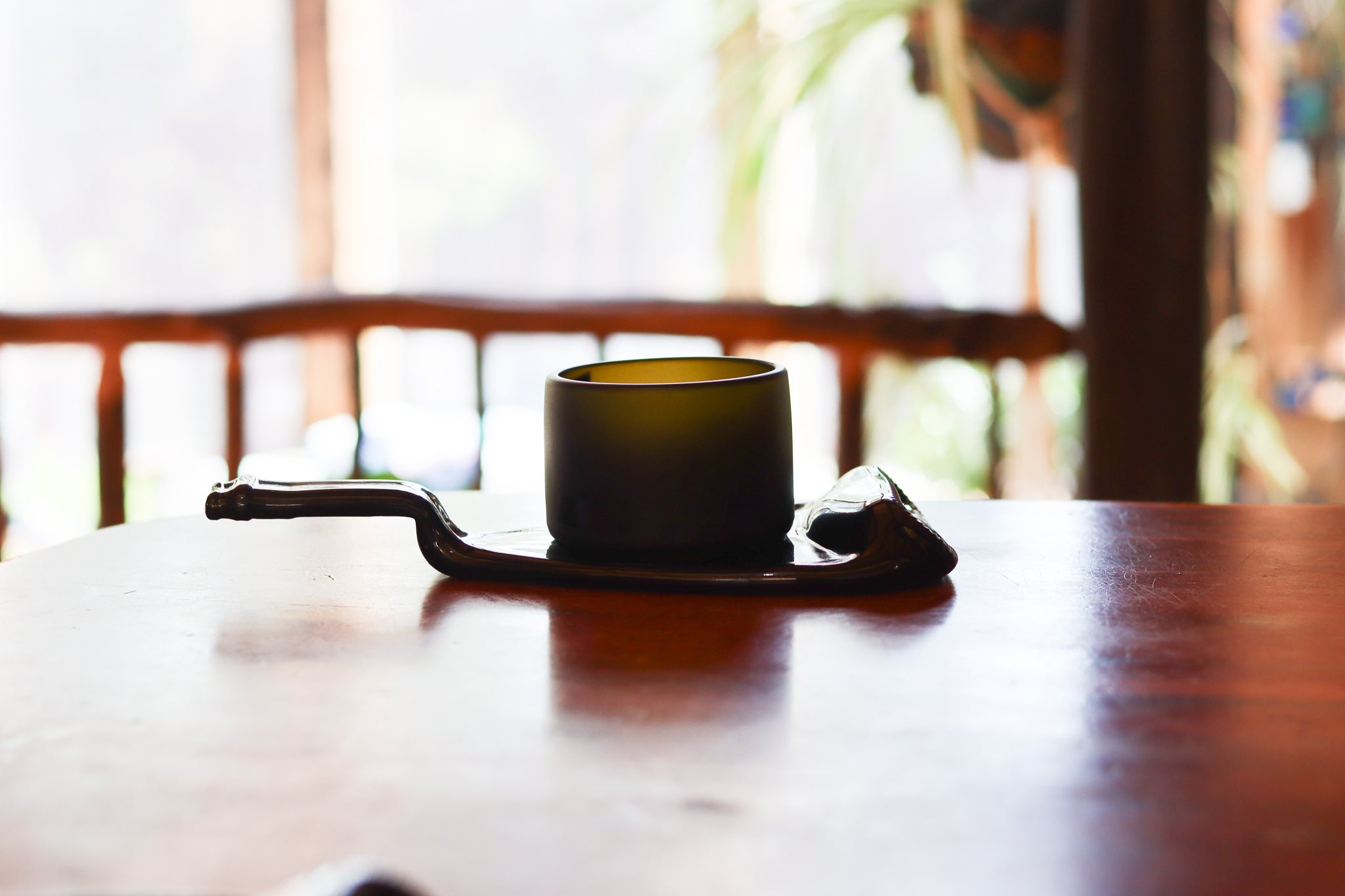 Handcrafted Prestige Collection Punt Dish by ReValued Glass, showcasing the entertainment options and historical silhouette of upcycled champagne bottles for a blend of luxury and sustainability.