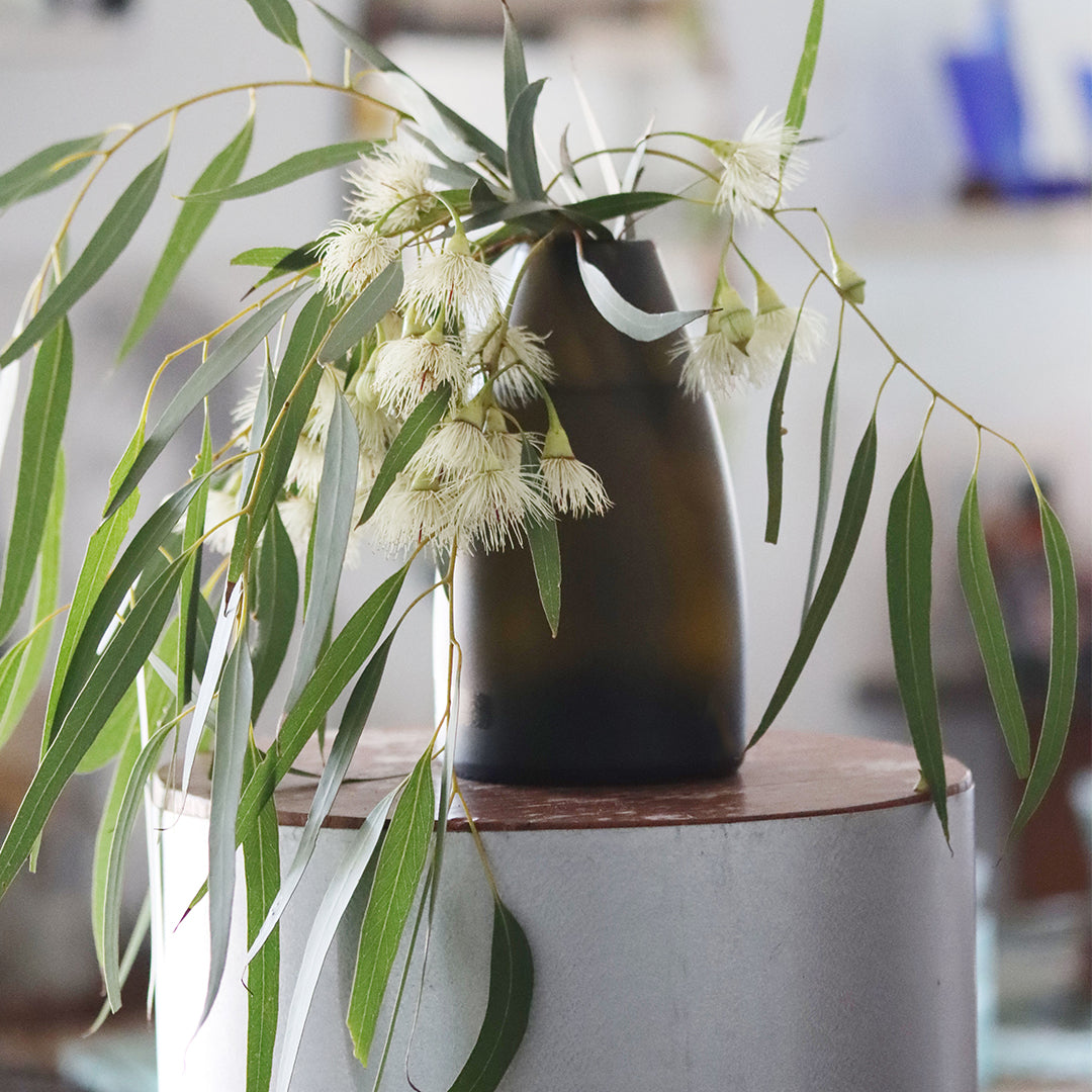 Artisan-crafted Prestige Vase, a sustainable decor piece from reclaimed champagne  and sparkling bottles