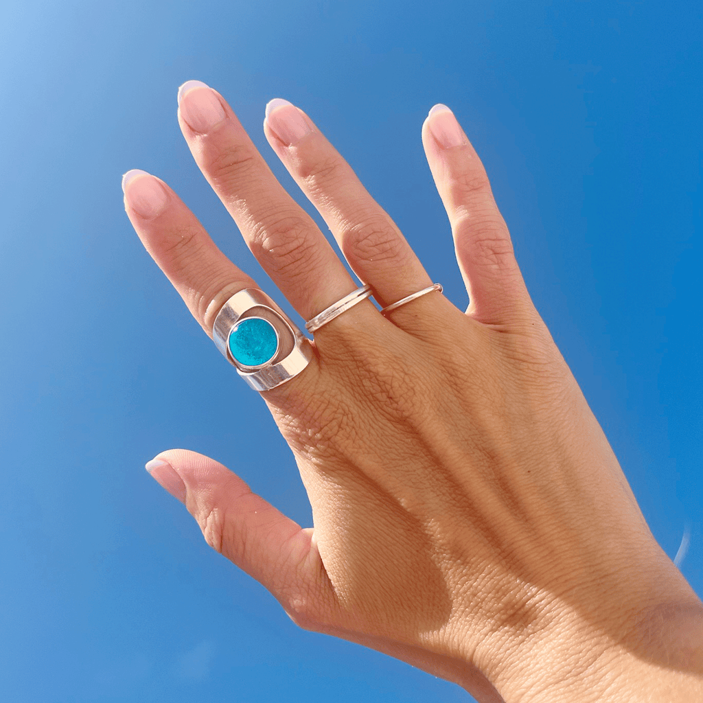 wrap ring on hand with blue sky background